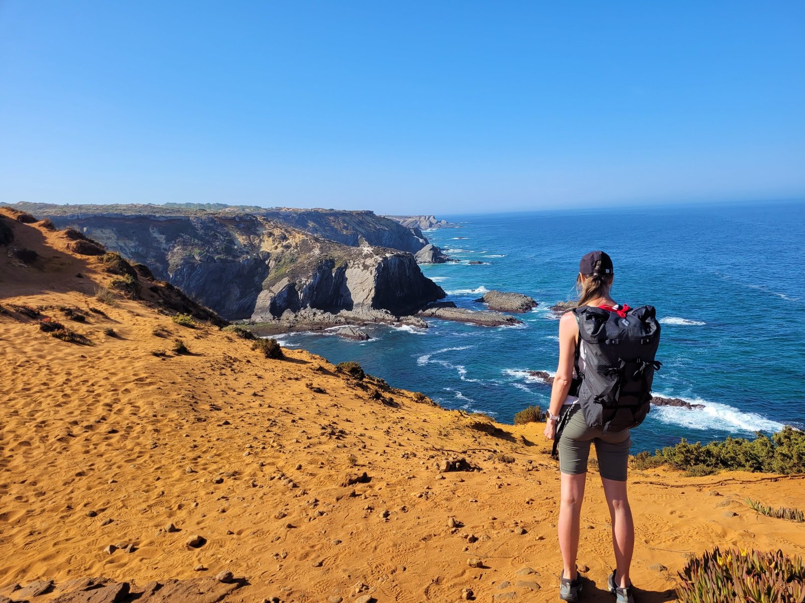 Red sand dunes, cliffs and sunburnt skin
